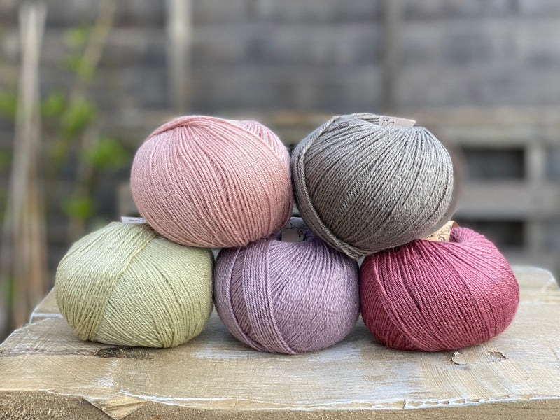 Five balls of Milburn in pink, purple, grey and green