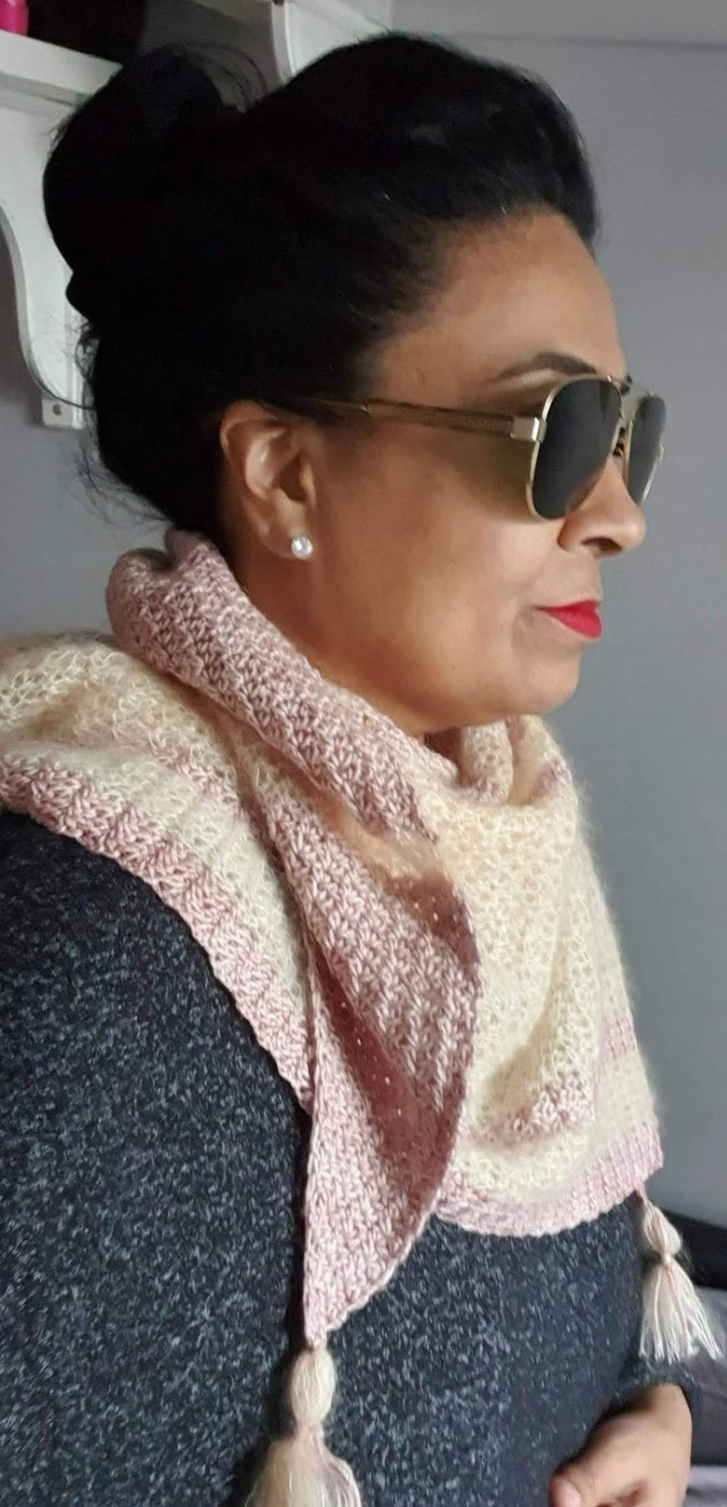 Helda wearing a pink and peach shawl