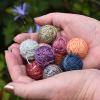 Hands holding a pile of Yarnlings