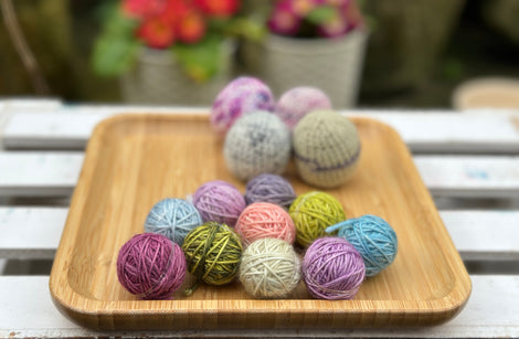 Ten tiny balls of yarn in floral colours