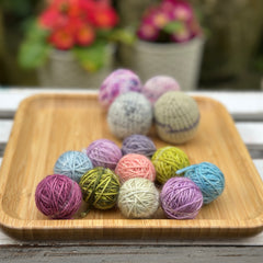 Ten tiny balls of yarn in floral colours