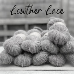 A black and white image of fluffy laceweight yarn. Lowther Lace is written in black text across the top of the image