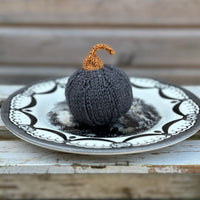 a knitted pumpkin made in Milburn DK in Charcoal