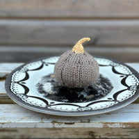 a knitted pumpkin made in Milburn DK in Compost