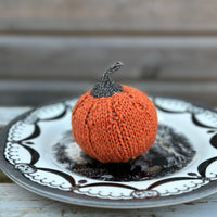 a knitted pumpkin made in Milburn DK in Crocosmia