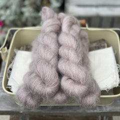 Five skeins of light brown fluffy yarn