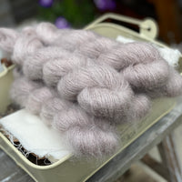 Five skeins of light brown fluffy yarn