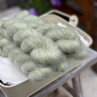 Five skeins of green fluffy yarn