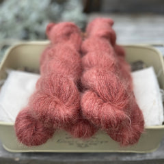 Five skeins of red fluffy yarn