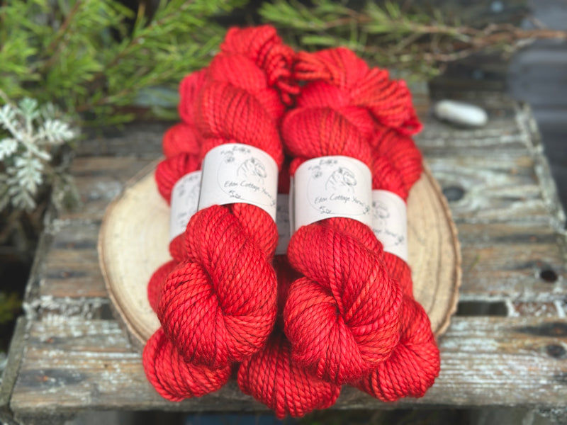 Five skeins of bright red yarn