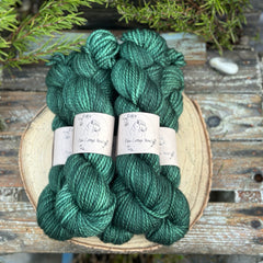 Five skeins of dark green yarn