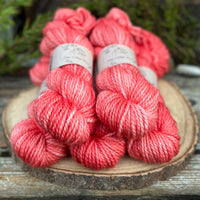 Five skeins of bright pink yarn