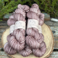 Five skeins of light brown yarn