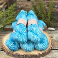 Five skeins of bright blue yarn