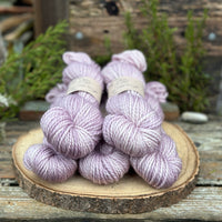 Five skeins of pale purple yarn