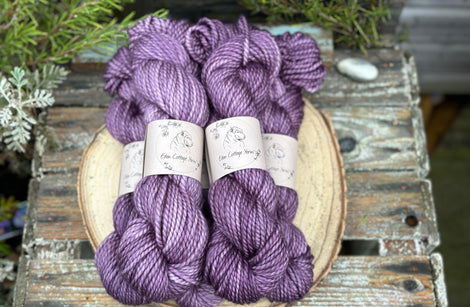 Five skeins of purple yarn