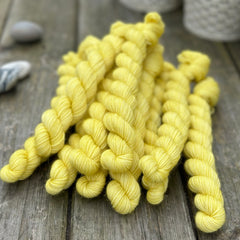 Yellow mini skeins of yarn