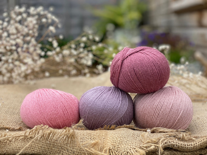 Four balls of Milburn in shades of pink and purple