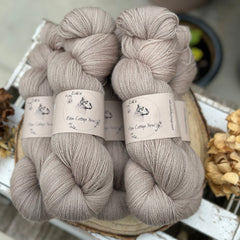Five skeins of light brown yarn