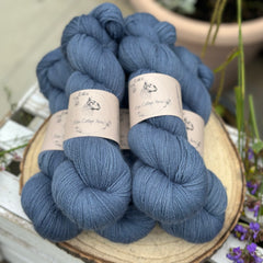 Five skeins of blue laceweight yarn