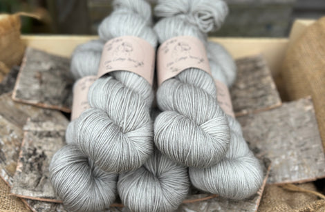 Five skeins of grey yarn