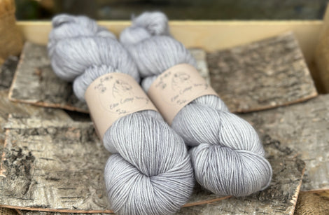 Two skeins of grey yarn
