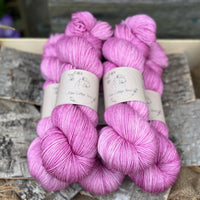 Five skeins of purpley pink yarn