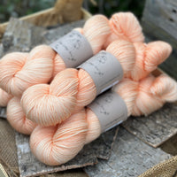Five skeins of light orange yarn
