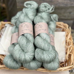 Five skeins of pale blue-green yarn