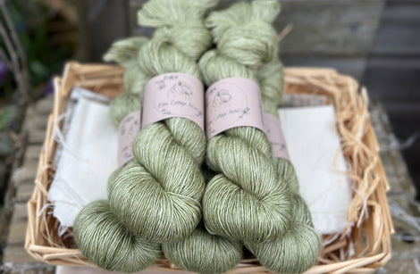 Five skeins of green yarn