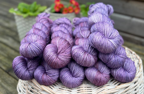 Skeins of variegated purple yarn