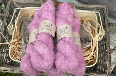 Five skeins of fluffy pink yarn