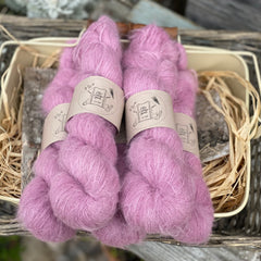 Five skeins of fluffy pink yarn