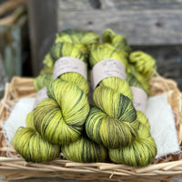 Five skeins of variegated green yarn