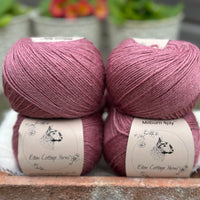 Balls of purple yarn