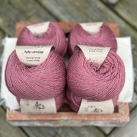 Balls of purple yarn