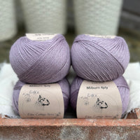 Balls of pale purple yarn