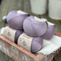 Balls of pale purple yarn