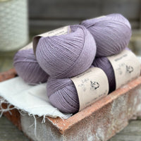 Balls of pale purple yarn