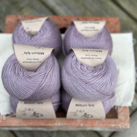 Balls of pale purple yarn
