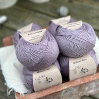 Balls of pale purple yarn