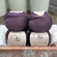 Balls of dark purple yarn
