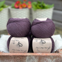 Balls of dark purple yarn