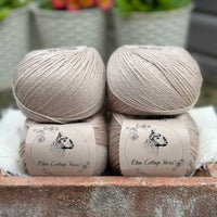 Balls of beige yarn
