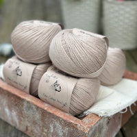 Balls of beige yarn