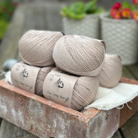 Balls of beige yarn