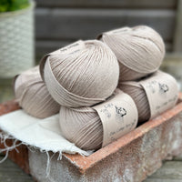 Balls of beige yarn