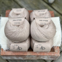 Balls of beige yarn