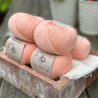 Balls of peachy orange yarn