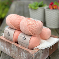 Balls of peachy orange yarn
